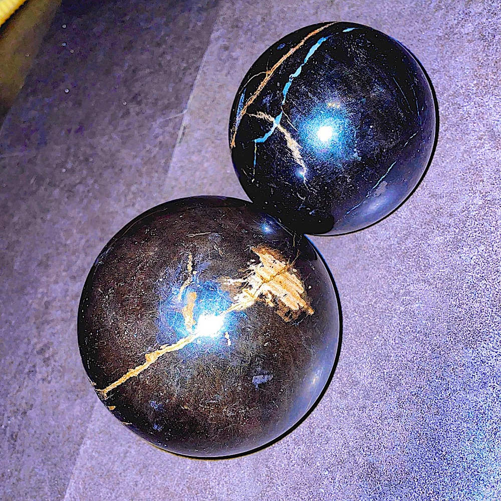 Petrified wooden bram balls, decorative spheres by “Made Good” home goods.